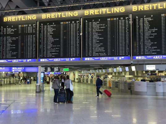 FRANKFURT, GERMANY - DECEMBER 6, 2016: Passengers visit Terminal 1 of Frankfurt International Airport in Germany. It is the 12th busiest airport in the world with 61 million passengers in 2015.